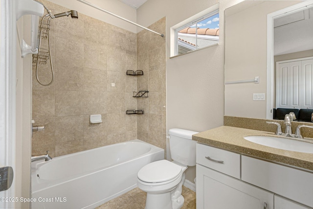 full bathroom with tiled shower / bath, vanity, toilet, and tile patterned flooring