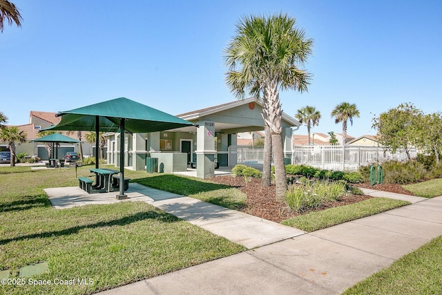 surrounding community featuring a gazebo and a lawn