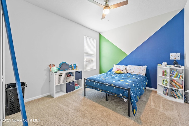 carpeted bedroom featuring ceiling fan and vaulted ceiling