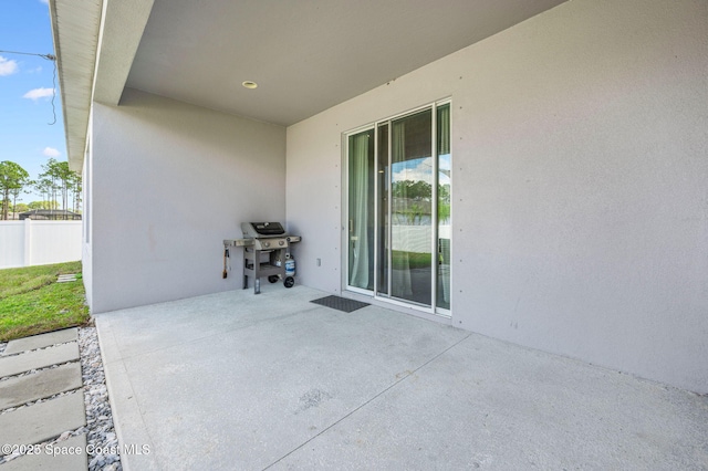 view of patio with a grill