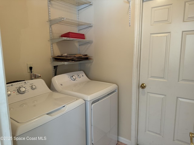 laundry room featuring washing machine and dryer