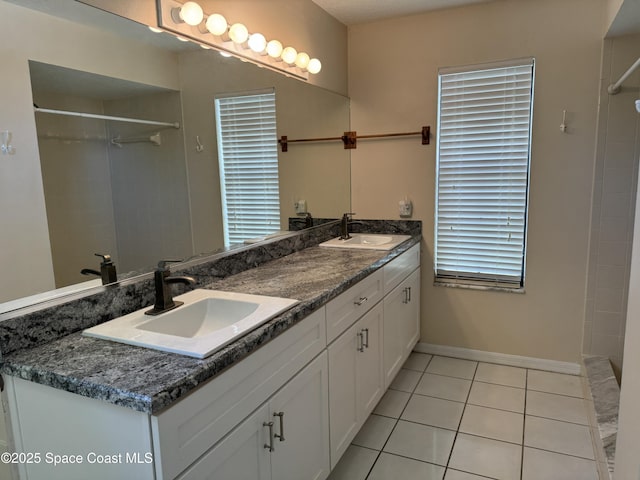 bathroom with vanity and tile patterned floors