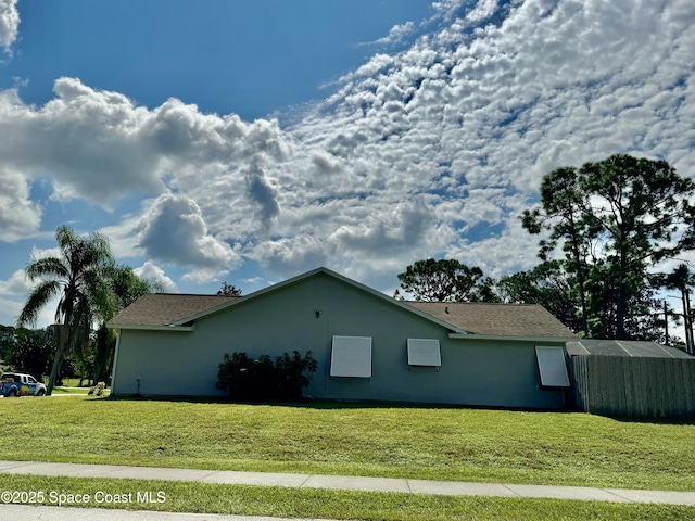 view of home's exterior featuring a lawn