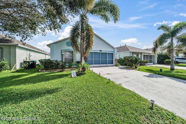 ranch-style home with a garage, concrete driveway, a front yard, and stucco siding