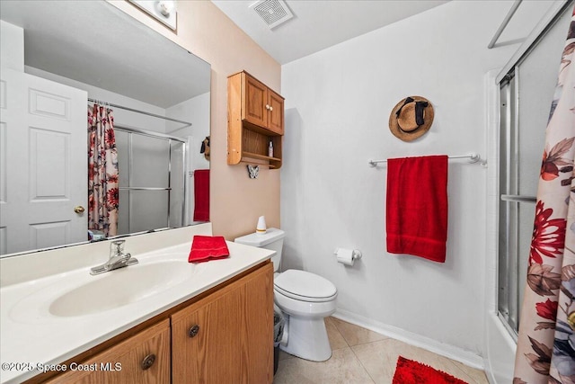 bathroom featuring visible vents, bath / shower combo with glass door, toilet, tile patterned floors, and vanity