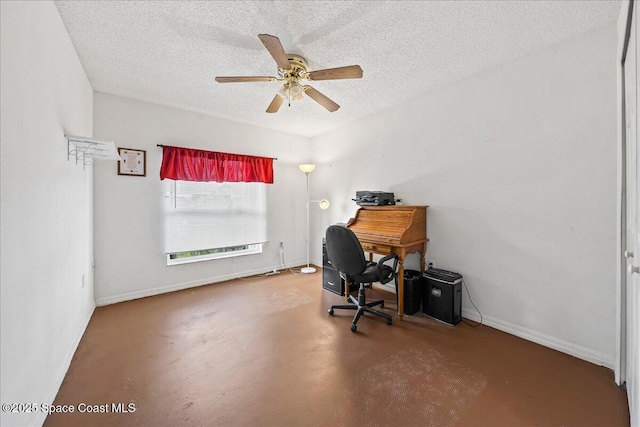 office area with ceiling fan, finished concrete floors, baseboards, and a textured ceiling