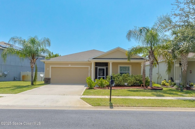 view of front of house featuring a garage and a front yard