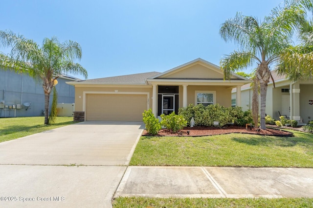 ranch-style home featuring a garage and a front lawn