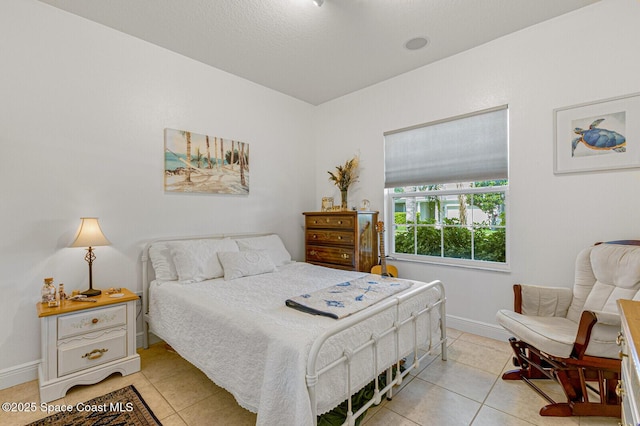 bedroom featuring light tile patterned flooring