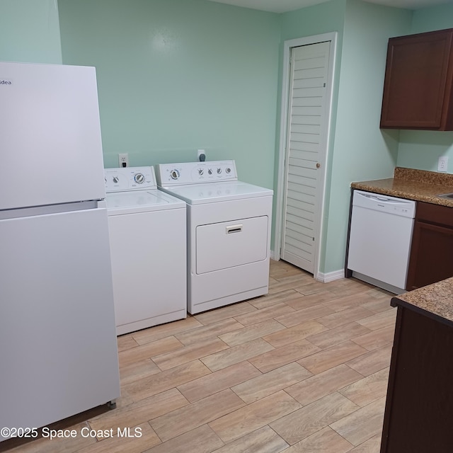 laundry room featuring separate washer and dryer