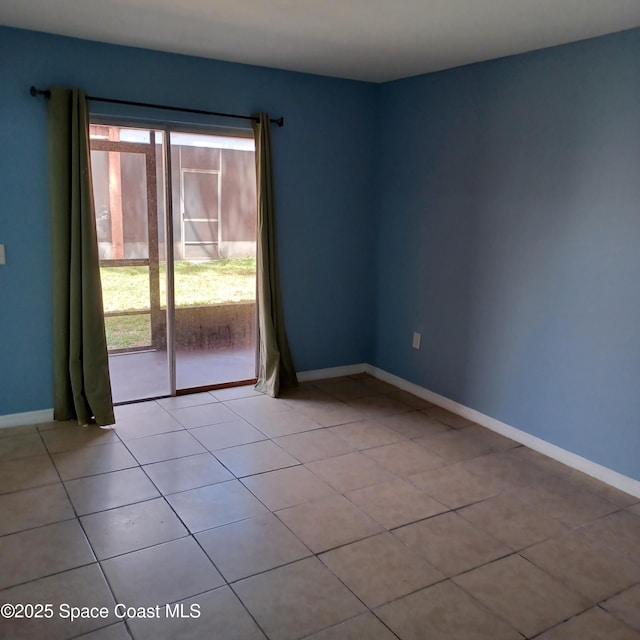 spare room featuring light tile patterned floors