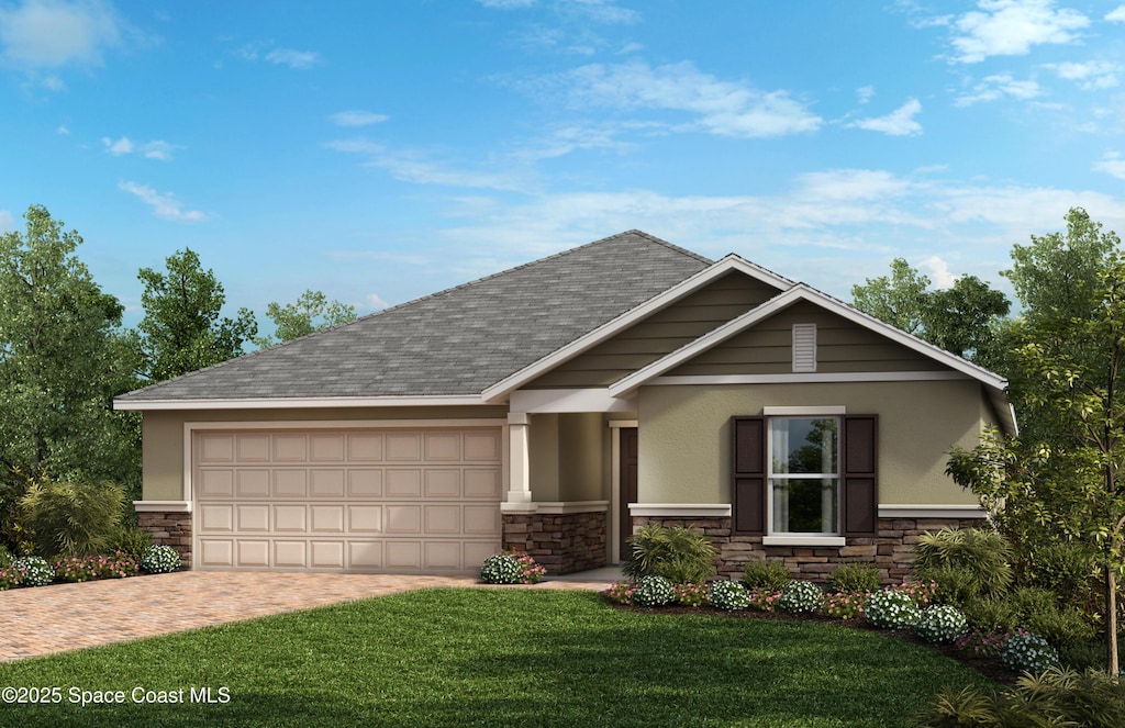 view of front of property featuring a garage and a front yard