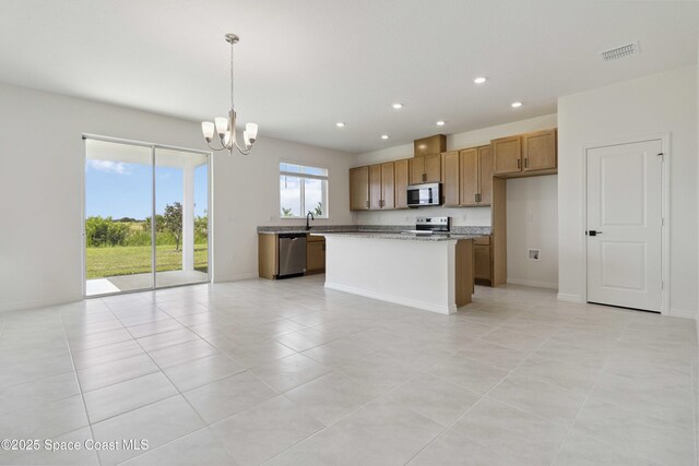 416 Glaspell Cir SE, Palm Bay, FL 32909 - kitchen featuring appliances with stainless steel finishes, a chandelier, recessed lighting, light tile patterned flooring, and hanging light fixtures