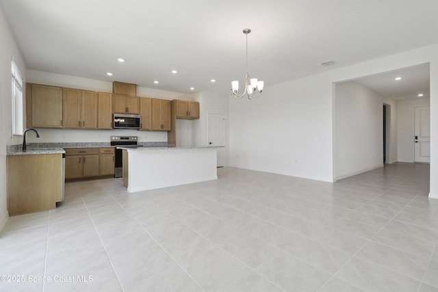 416 Glaspell Cir SE, Palm Bay, FL 32909 - kitchen with appliances with stainless steel finishes, open floor plan, recessed lighting, a chandelier, and light tile patterned flooring