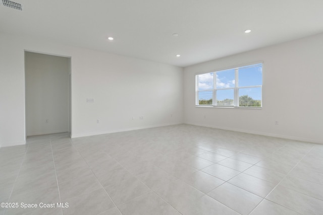 416 Glaspell Cir SE, Palm Bay, FL 32909 - spare room featuring recessed lighting and light tile patterned floors