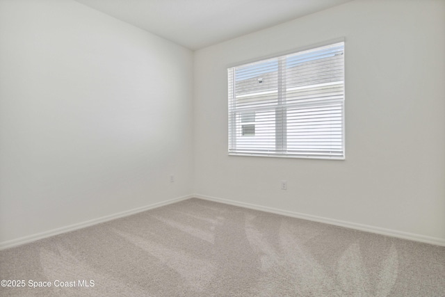 416 Glaspell Cir SE, Palm Bay, FL 32909 - empty room featuring light carpet and baseboards
