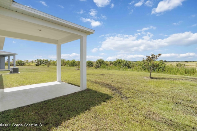 416 Glaspell Cir SE, Palm Bay, FL 32909 - view of grassy yard featuring a patio area