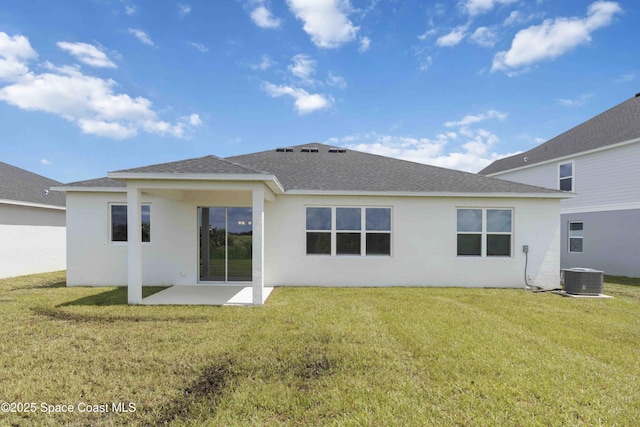416 Glaspell Cir SE, Palm Bay, FL 32909 - rear view of house featuring roof with shingles, a patio area, stucco siding, and a yard