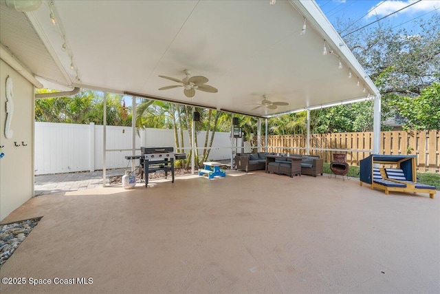 view of patio / terrace with a fenced backyard, grilling area, and a ceiling fan