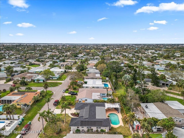 birds eye view of property with a residential view