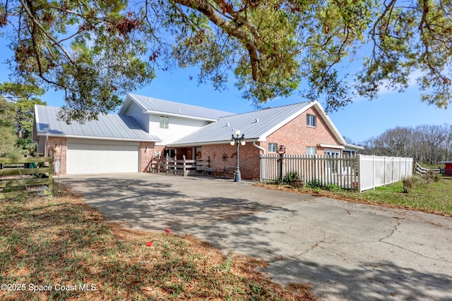 view of side of property with a garage