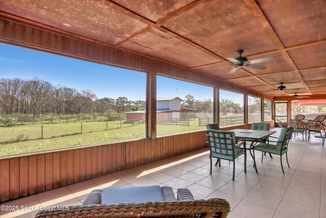 sunroom with coffered ceiling and ceiling fan