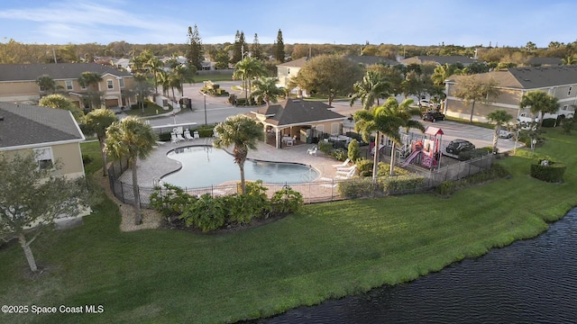 aerial view featuring a water view and a residential view