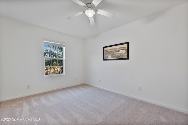 empty room with light carpet and baseboards