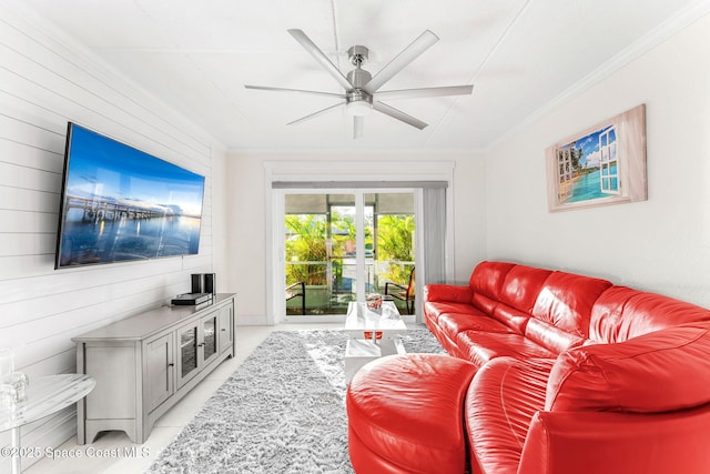 living room featuring ornamental molding, light tile patterned flooring, and ceiling fan
