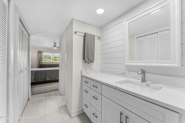 bathroom featuring vanity, tile patterned flooring, and ceiling fan