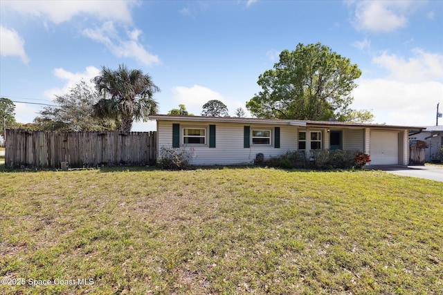 single story home with a garage, a front yard, concrete driveway, and fence