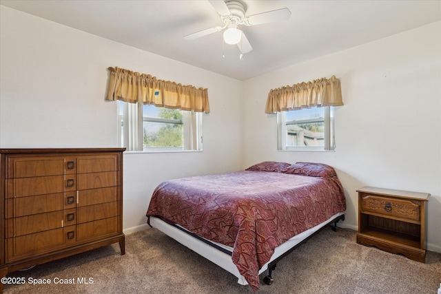 bedroom featuring ceiling fan, carpet, and baseboards