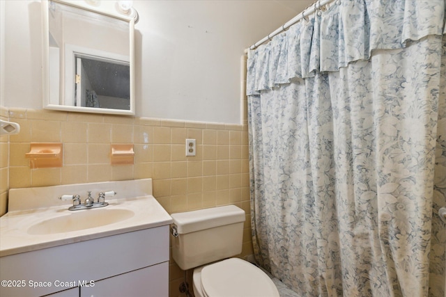 full bathroom featuring toilet, vanity, tile walls, and a shower with shower curtain