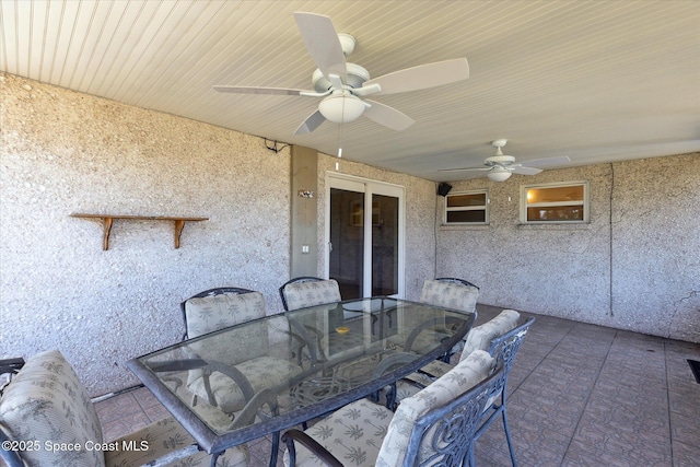 view of patio / terrace featuring ceiling fan and outdoor dining space