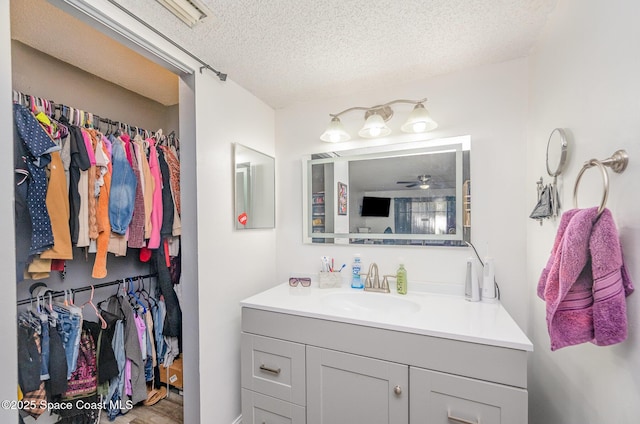 bathroom featuring vanity and a textured ceiling