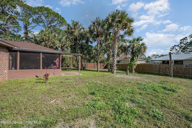 view of yard with a sunroom