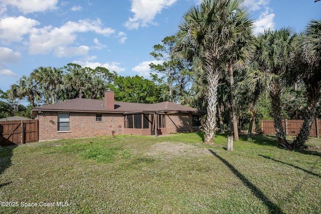 back of house with a yard