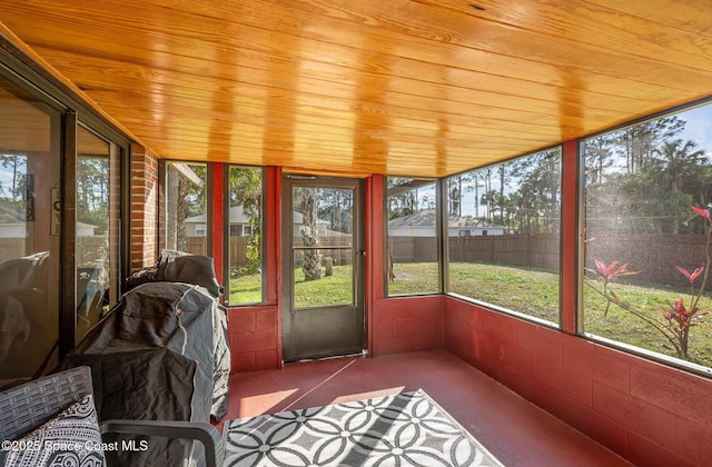 unfurnished sunroom featuring wooden ceiling