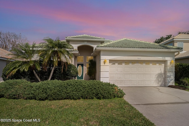 mediterranean / spanish-style house featuring a garage