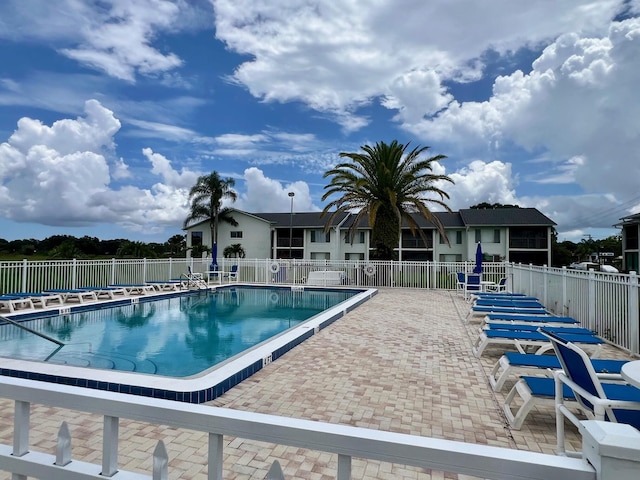 view of swimming pool with a patio area