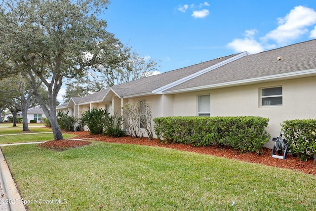 ranch-style home featuring a front lawn