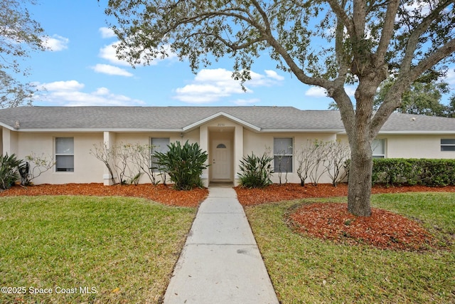 ranch-style home featuring a front yard