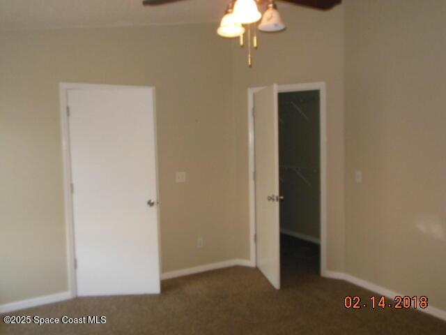 unfurnished bedroom with carpet and ceiling fan