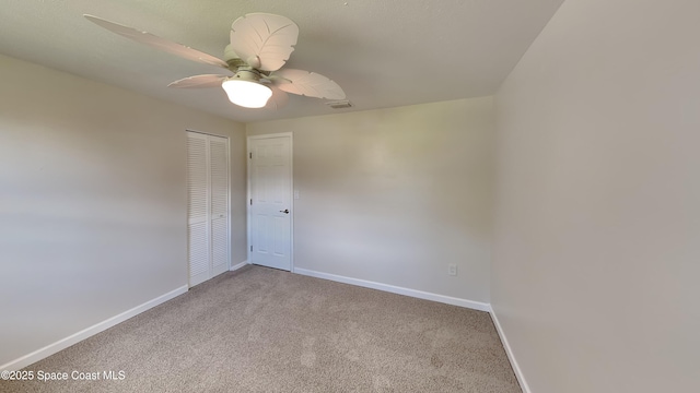 empty room with light carpet and ceiling fan