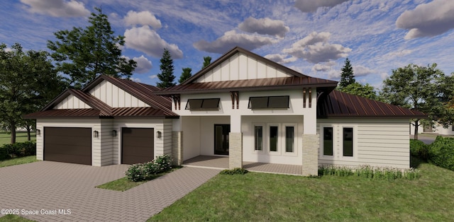 view of front of home featuring a garage and a front lawn