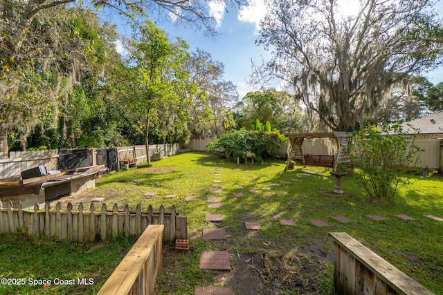 view of yard featuring a fenced backyard and a pergola