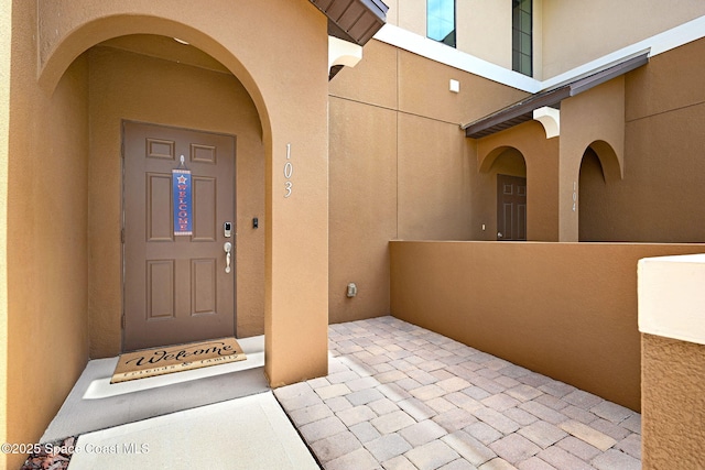 1425 Lara Cir Unit 103, Rockledge, FL 32955 - doorway to property featuring stucco siding