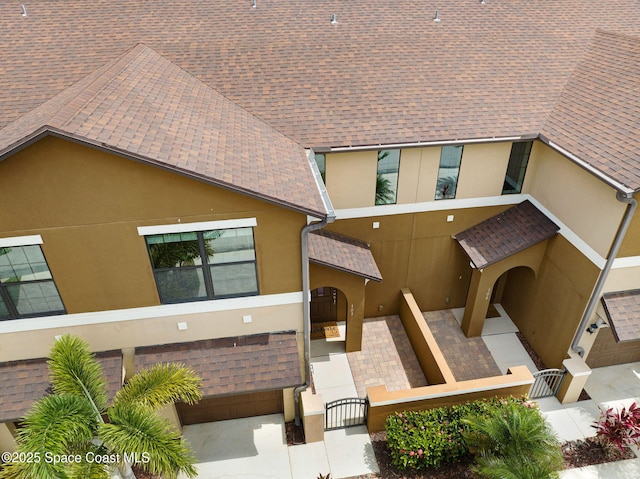 1425 Lara Cir Unit 103, Rockledge, FL 32955 - view of property featuring a fenced front yard and an attached garage