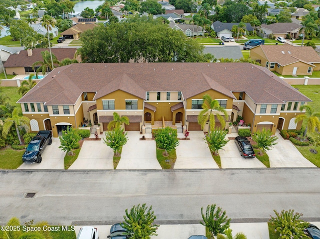 1425 Lara Cir Unit 103, Rockledge, FL 32955 - view of front of property featuring concrete driveway, a residential view, and stucco siding