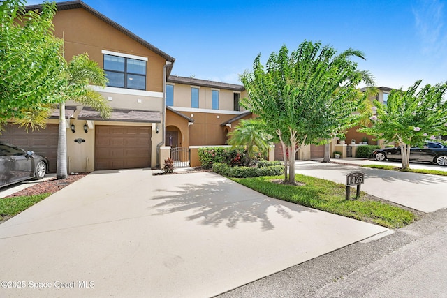 1425 Lara Cir Unit 103, Rockledge, FL 32955 - multi unit property with stucco siding, driveway, and an attached garage